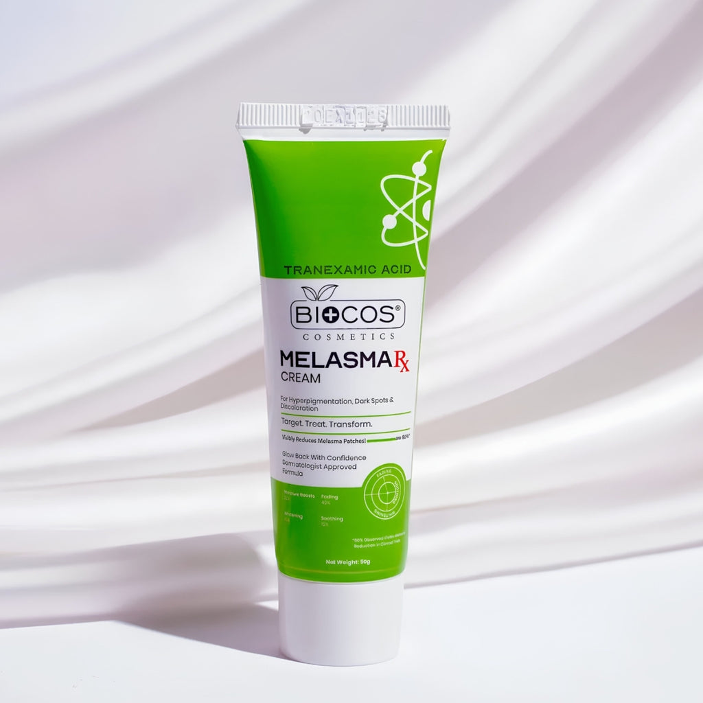 BIOCOS Cosmetics Melasmar Rx Tranexamic Acid Cream in a green and white squeeze tube, standing upright on a white surface with soft, draped shadows.