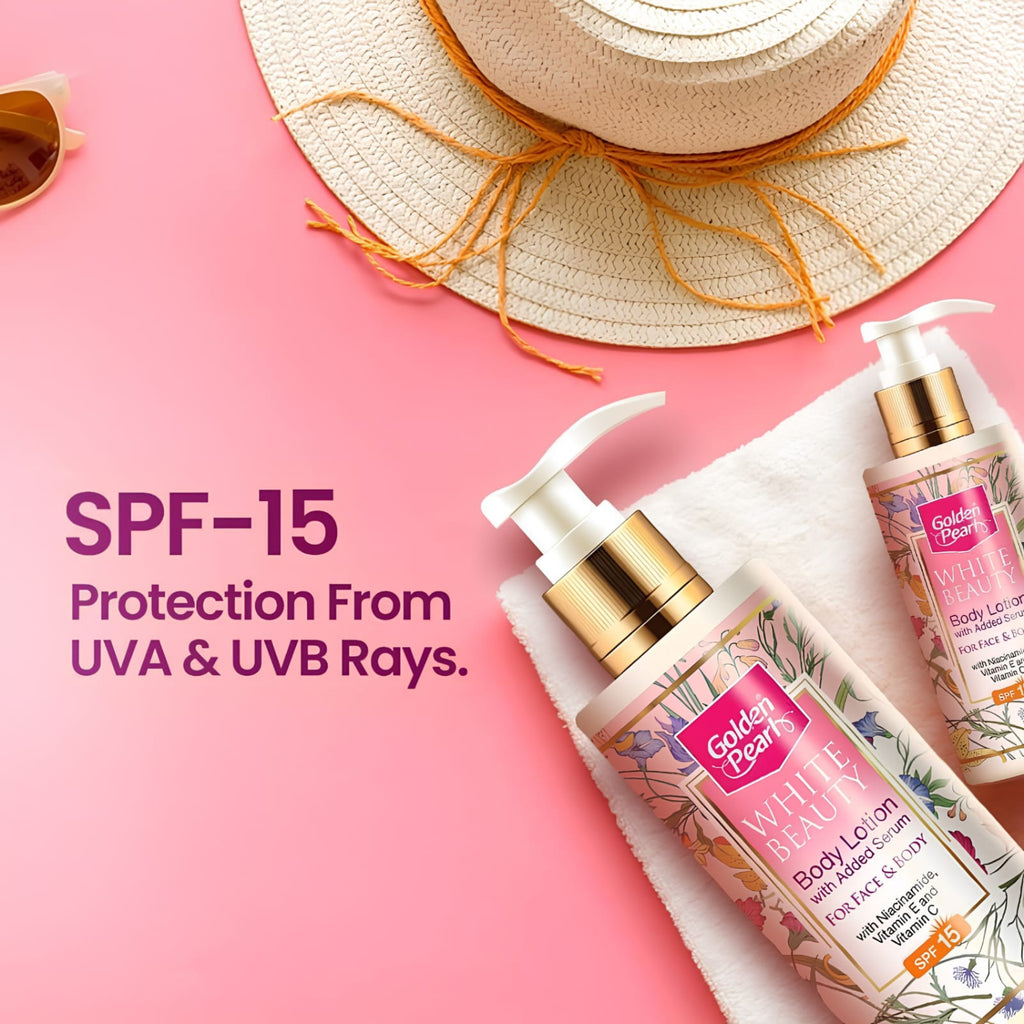 Two Golden Pearls White Marble SPF 15 Body Lotion bottles arranged on a white towel against a pink background, with a straw hat and partial sunglasses as props. Text on the left reads 'SPF-15 Protection From UVA & UVB Rays.
