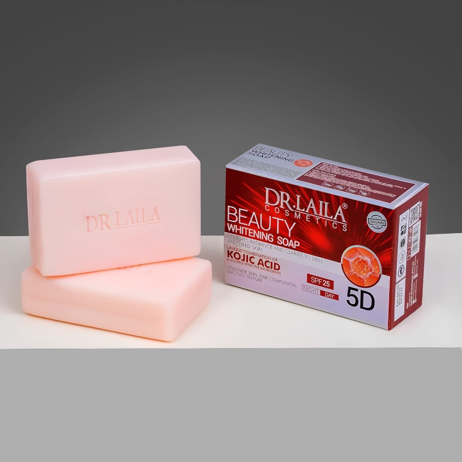 Two pale pink DR. LAILA Beauty Whitening Soap bars stacked on a white surface next to their red and white product packaging box.