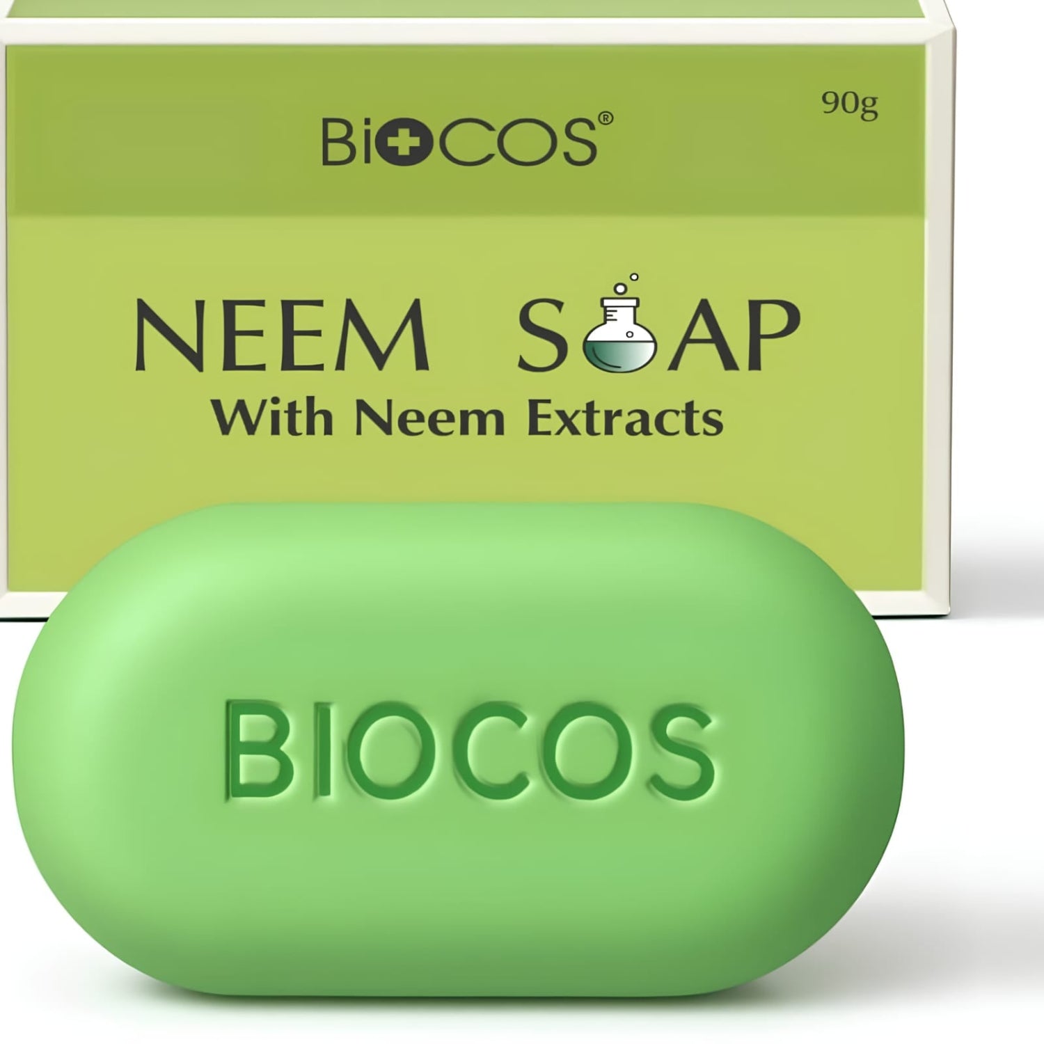 A green oval bar of BIOCOS Neem Soap with Neem Extracts in the foreground, with its matching light green cardboard packaging box behind it on a white background.