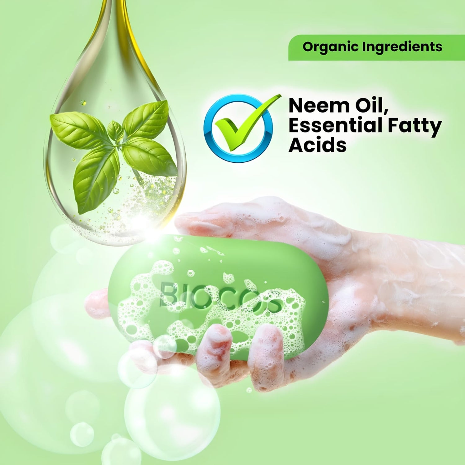 A hand holding a green bar of soap labeled 'BioCo' with soap foam, set against a light green background with promotional text reading 'Organic Ingredients' and 'Neem Oil, Essential Fatty Acids.' A droplet graphic shows a green leaf inside, and bubbles float around the soap.