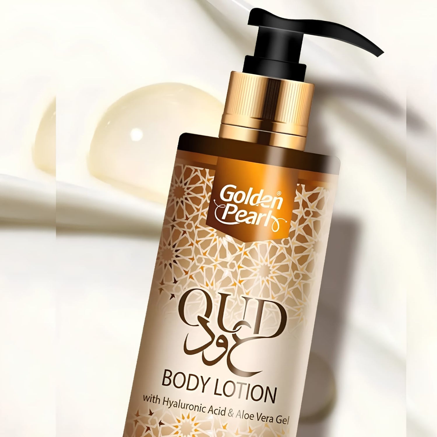 A bottle of Golden Pearls Qud Body Lotion with a black pump and gold collar, featuring a beige label with gold geometric patterns, set against a soft white background with a translucent droplet.