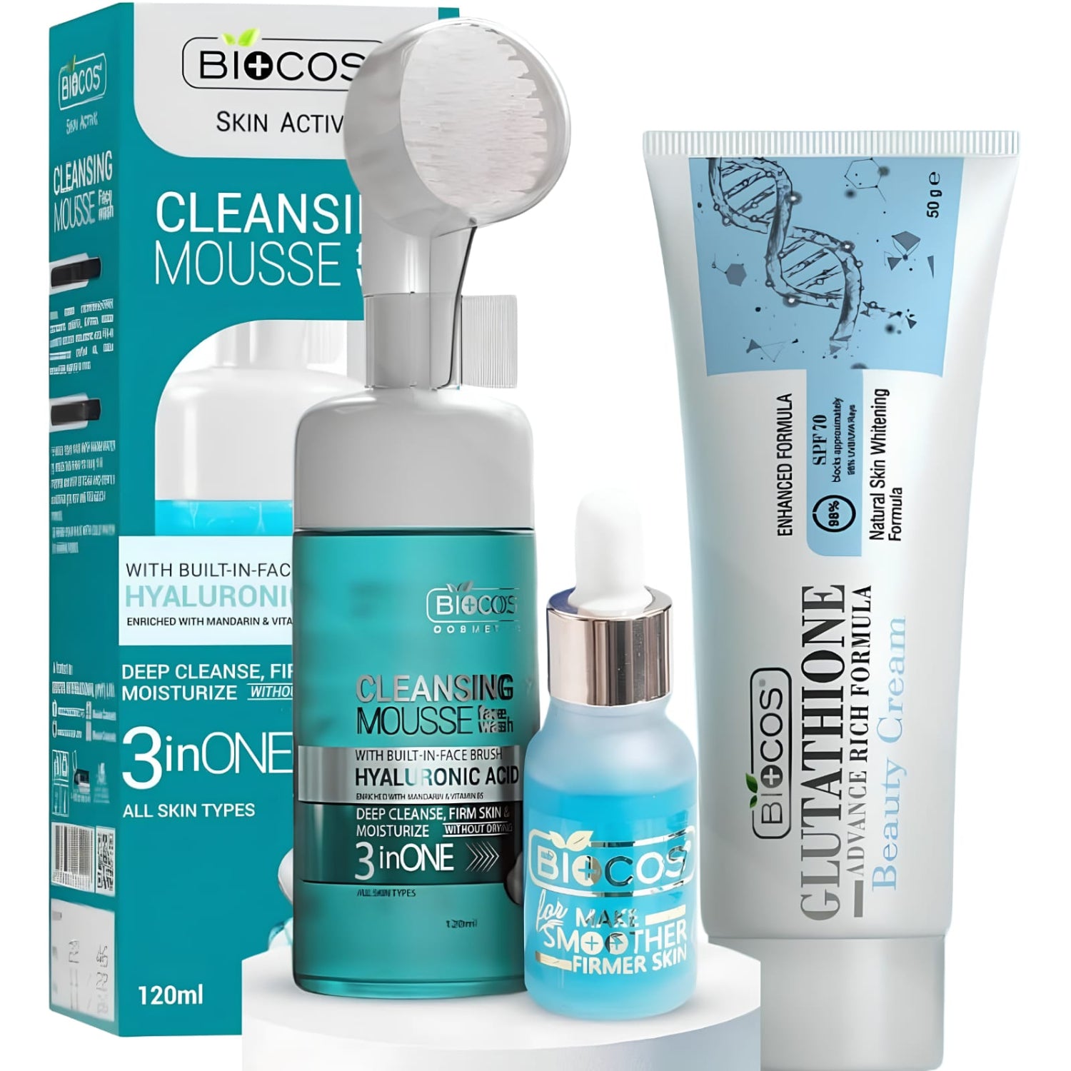 A skincare set from BioCos Cosmetics on a white background, featuring a Cleansing Mousse bottle with a built-in brush, a small serum bottle with a dropper, and a Glutathione Beauty Cream tube next to its retail box.